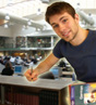 Student writing at his desk